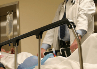 doctor and patient in hospital bed